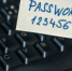 Hand is holding paper with password near keyboard - Вечер Елабуги